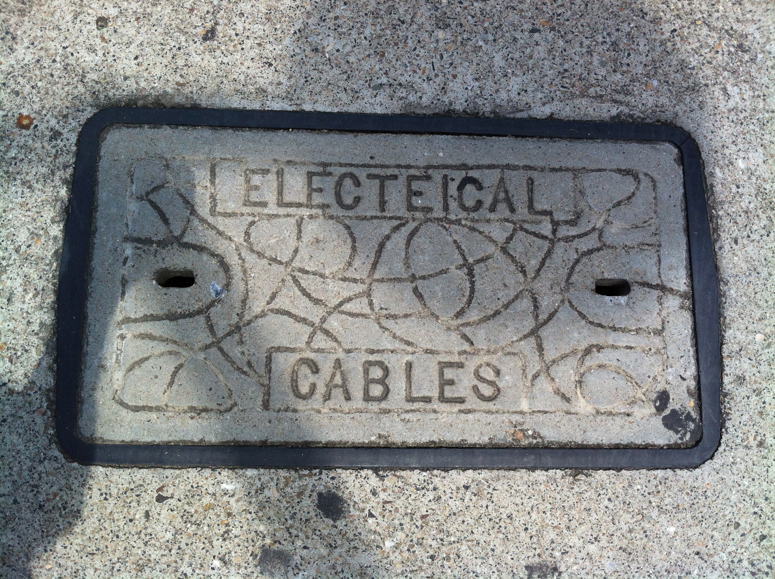 Concrete cover with the typo 'Electeical cables' 
